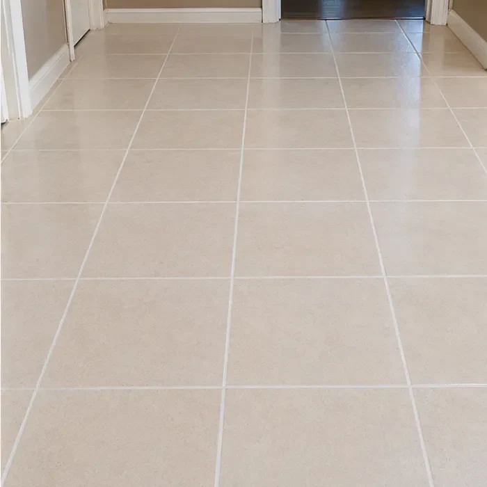 Same tiles with bright, clean grout lines fully restored after deep cleaning